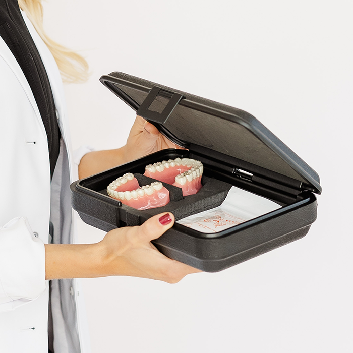 Doctor Lundgren holding an Invisalign kit