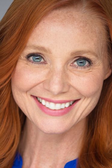 Woman with freckles smiling