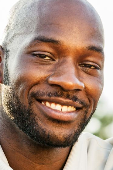 Smiling man with a short beard