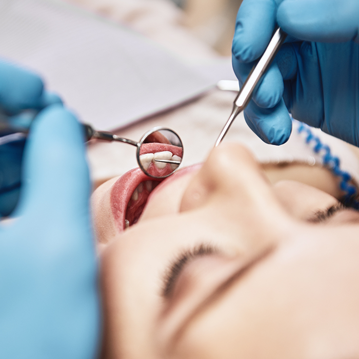 Woman receiving a dental exam